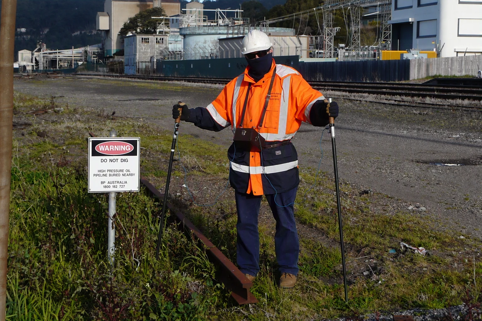 Technician conducting a pipeline coating and cathodic protection survey at a BP site
